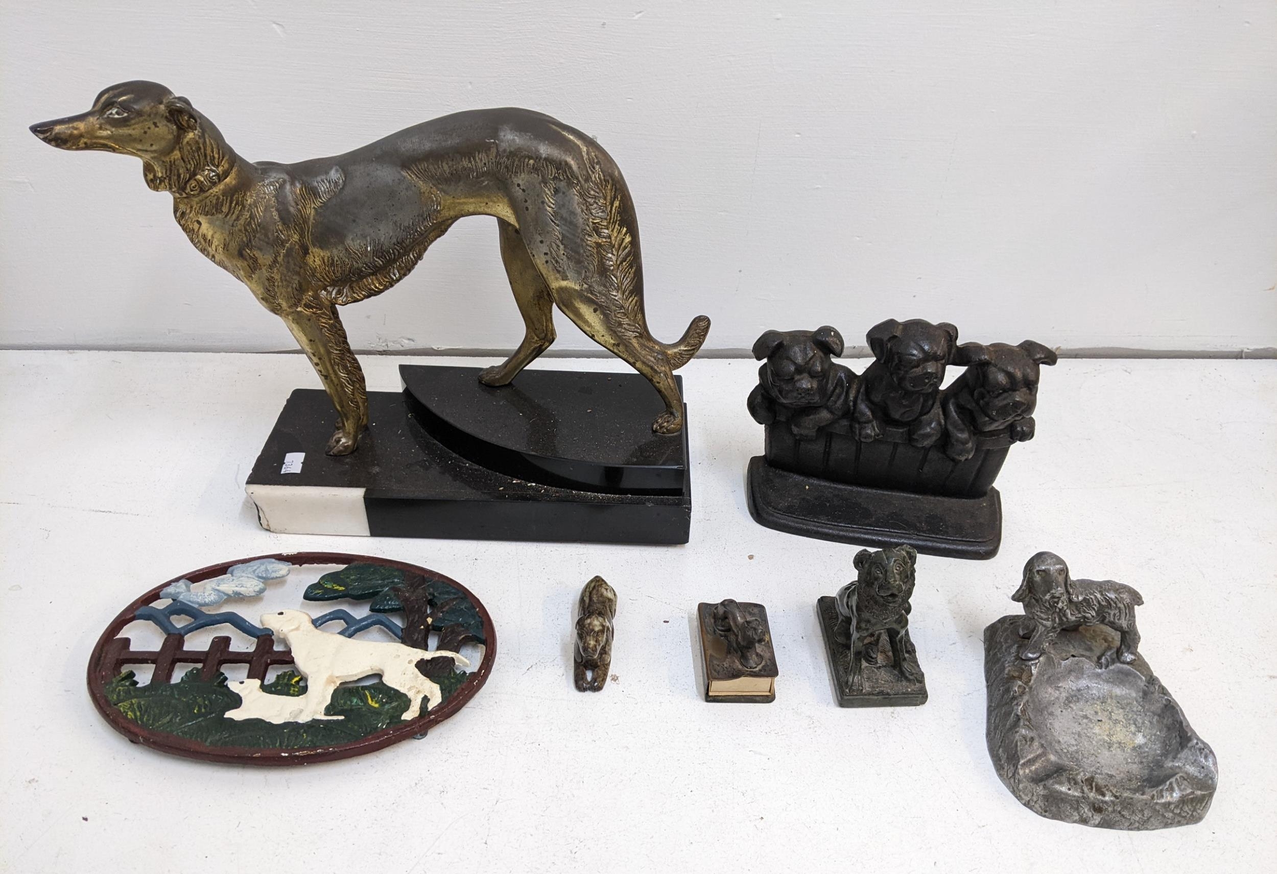 Canine related metalware to include a French Art Deco style brass figure of a greyhound, a door