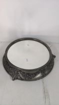 An early 20th century silver plated Adam relief style tray with a mirror top, on scrolled feet