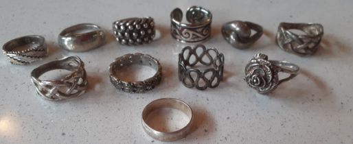 A group of 11 silver and white metal costume rings, weight 42.05g. Location:Cab If there is no