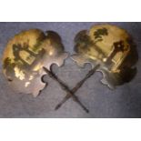 A pair of late 19th Century treen face fans having painted scenes of church ruins and figures