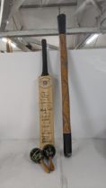 A signed Gloucestershire County cricket club cricket bat, together with a pair of maracas and a