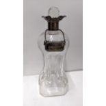 An Edwardian silver mounted glug-glug glass decanter with a pinched glass body Location: If there is