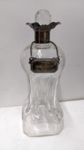 An Edwardian silver mounted glug-glug glass decanter with a pinched glass body Location: If there is