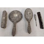 A silver dressing table set to include a hairbrush, comb, mirror and other items Location: If