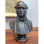 A late 19th /early 20th century patinated bronze bust of a gentleman wearing traditional dress on