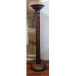 An early 20th century mahogany torchere with a spiral column Location:BWR If there is no condition