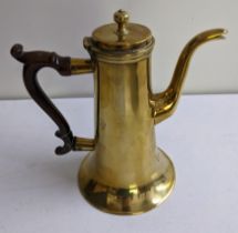 A 19th century brass coffee pot with turned timber handle Location: 1-1 If there is no condition