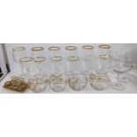 Glassware to include as et of French gold rimmed drinking glasses, bowls and shot glasses in a