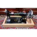 A 1921 15k Singer sewing machine on later wooden base, serial no:Y315081. Location:A1M If there is