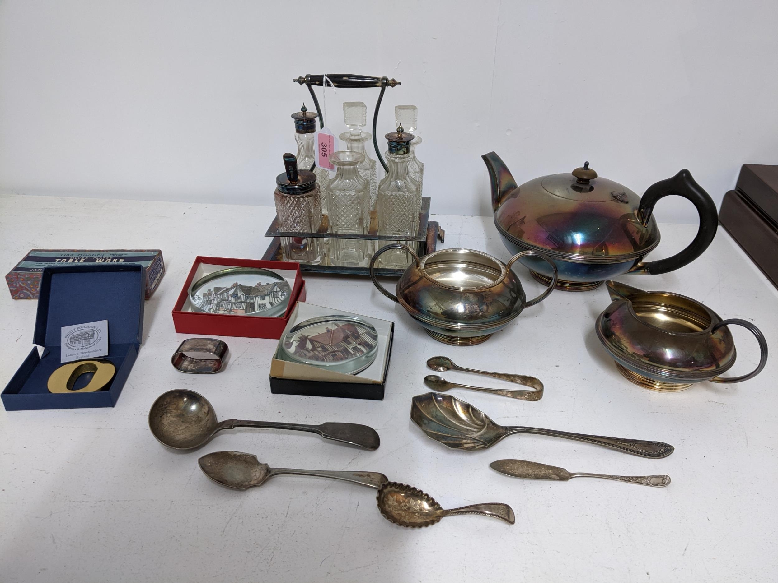 A mixed lot of silver plated items to include a three piece tea set, a six bottle cruet stand with