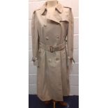 Burberry-A 1970's beige double breasted 'Kensington' lightweight cotton trench coat having brown