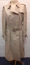 Burberry-A 1970's beige double breasted 'Kensington' lightweight cotton trench coat having brown
