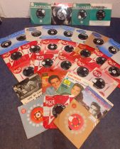 A quantity of 45rpm singles to include Elvis on RCA label, The Beatles on Parlophone label and