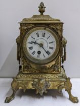 A late 19th century French gilt metal 8 day mantle clock having a white enamel signed dial and