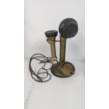 An early to mid 20th century brass candlestick telephone Location: If there is no condition report