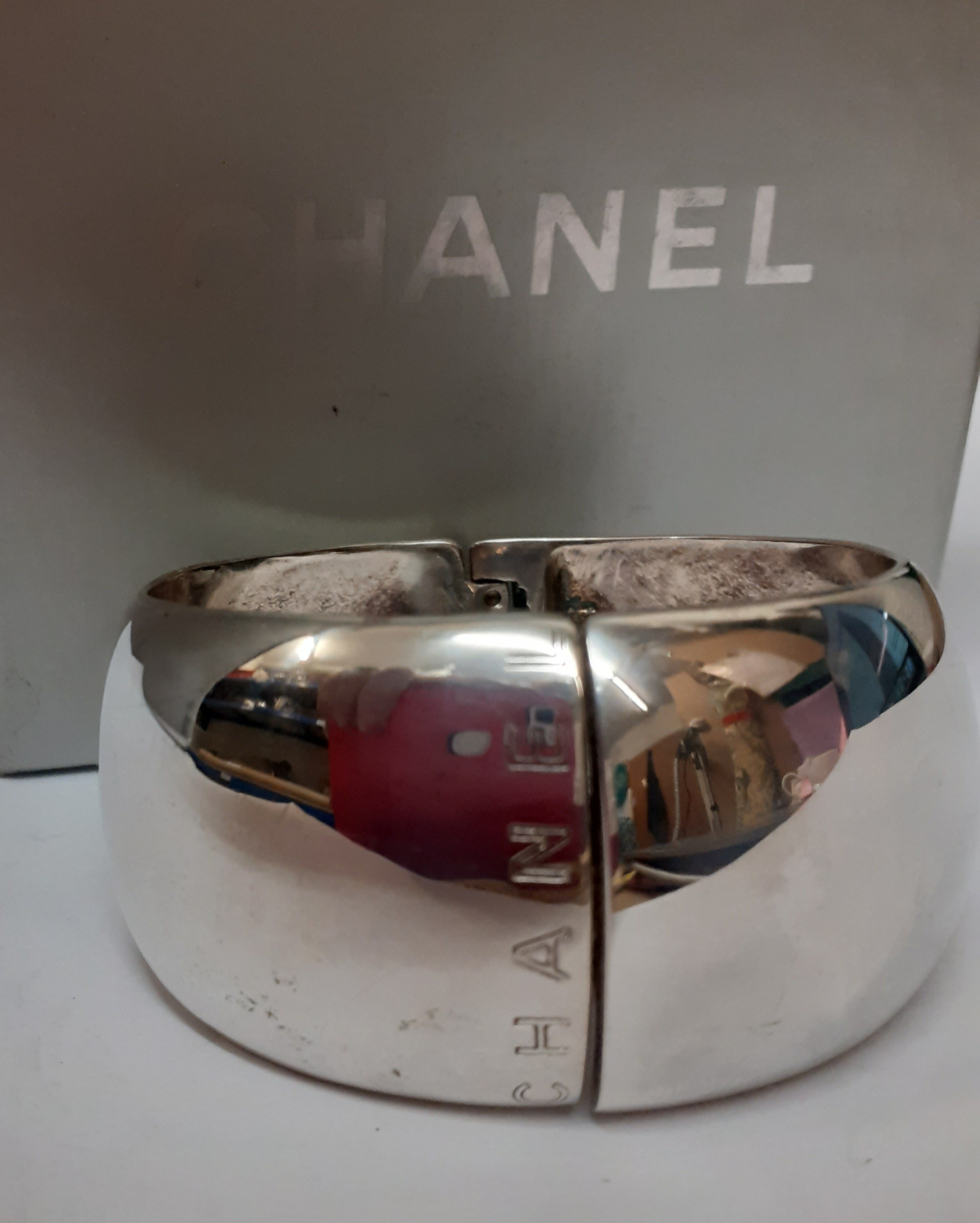 Chanel-A wide silver cuff bangle branded towards the opening and to the hinge, stamped 925 with grey - Image 2 of 4