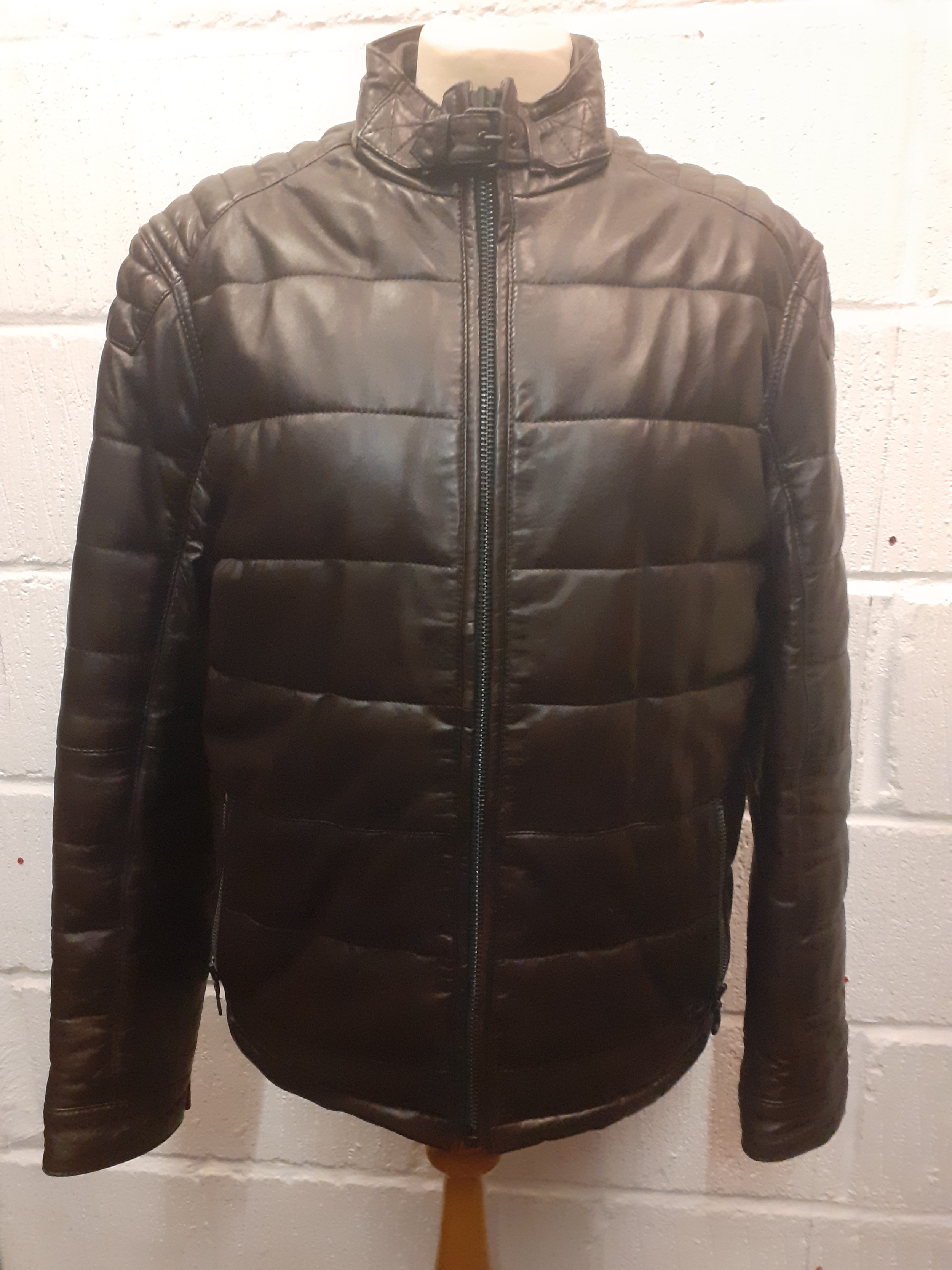 A modern gents dark brown padded soft leather Collezione sports jacket with front zip fastening