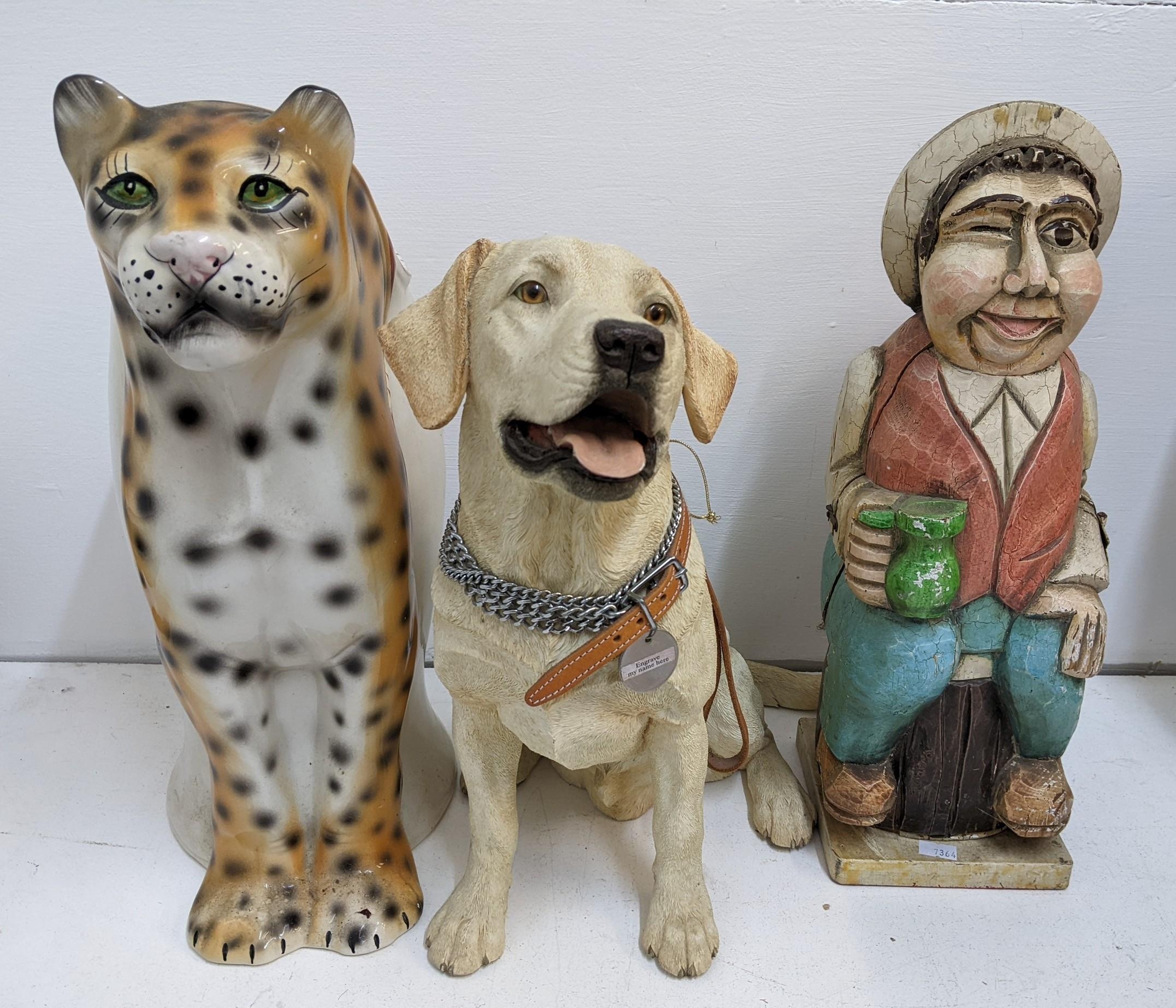 Mixed figurines to include a Dalmatian, Labrador, a vase shaped as a Leopard, a carved bottle holder