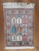 A Kayseri silk Kelim rug, 30" x 22" having cream tassel fringe to 2 ends and a Turkmen certificate