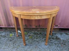 A mid 20th century Italian Sorrento inlaid fold over card table, inset green baize, on square