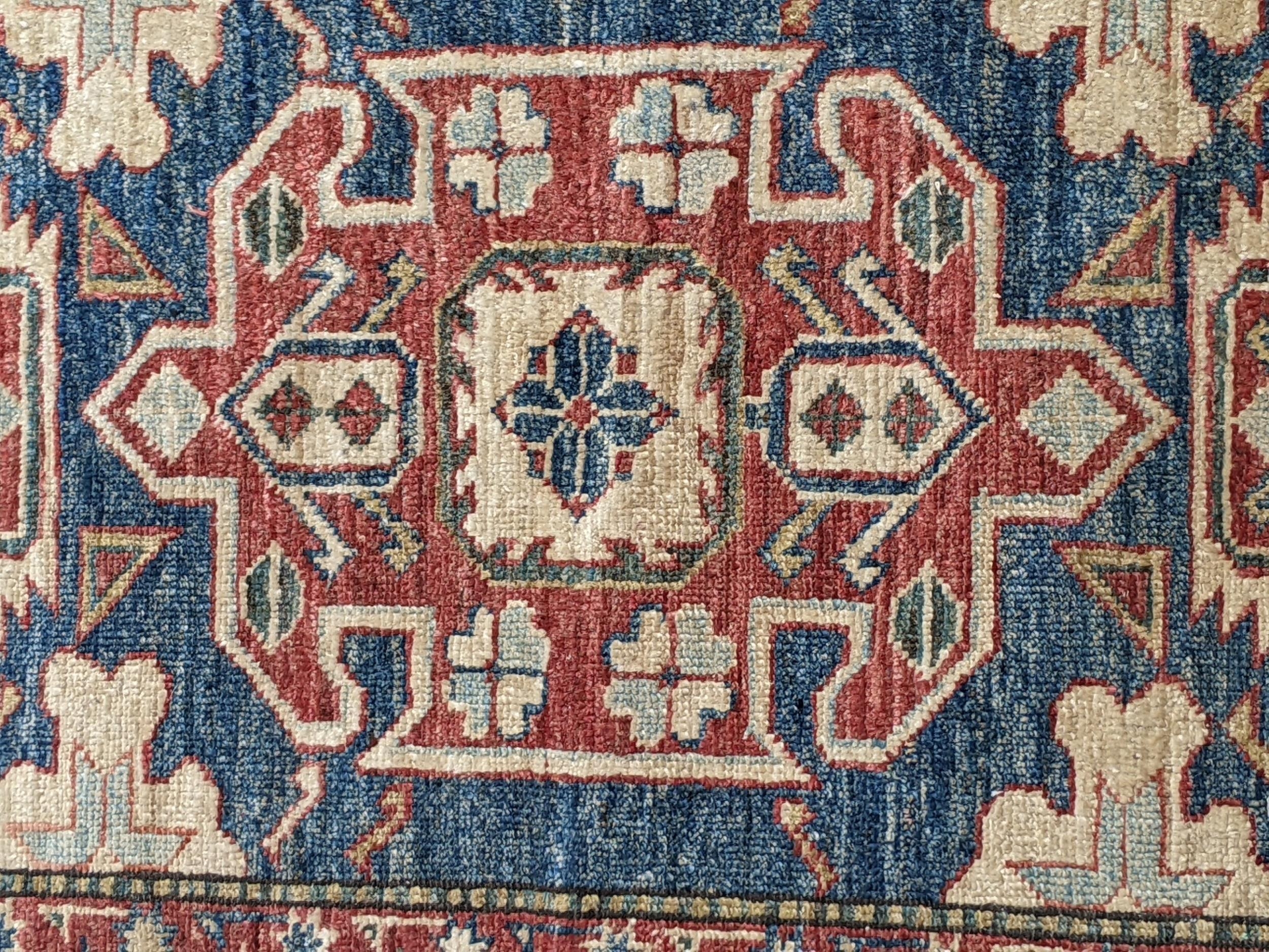 A Persian bidjar with a central emblem decorated symmetrically on a blue background with a cream and - Image 6 of 7