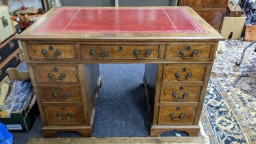 A late 20th century walnut twin pedestal desk with nine drawers, 73cm h x 107cm w Location: If there