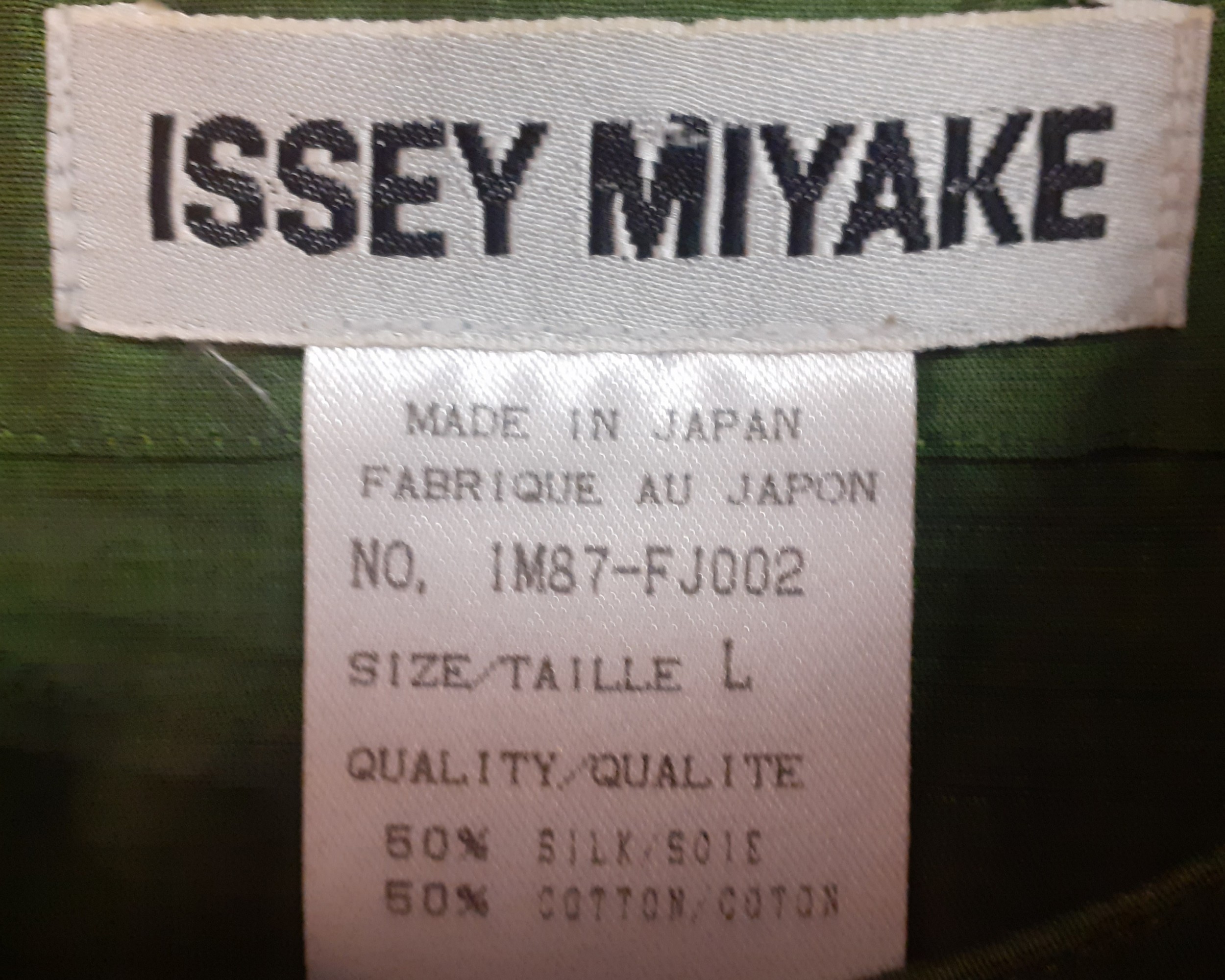 Issey Miyake- A green silk mix blouson jacket with silk knot buttons 36" chest together with a Kadra - Image 5 of 7