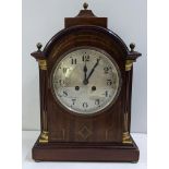 An early 20th century Regency style mahogany 8 day mantle clock with count wheel strike and a single