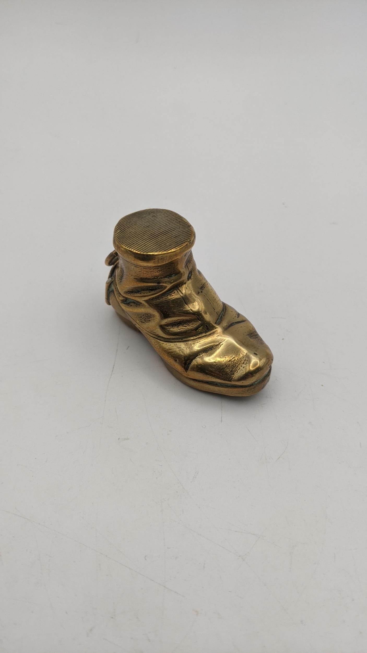 A brass vesta case fashioned as a boot Location: If there is no condition report shown, please