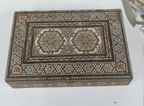 A Middle Eastern parquetry inlaid box, with repeating motifs within boarders Location:R2.2 If