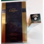 Cartier- A 50ml Must De Cartier Eau de Toilette natural spray in sealed box together with a silver