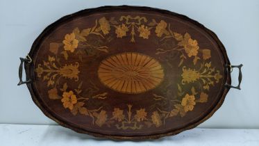 An Edwardian mahogany marquetry inlaid oval twin handled tray 66cm x 43cm Location: If there is no