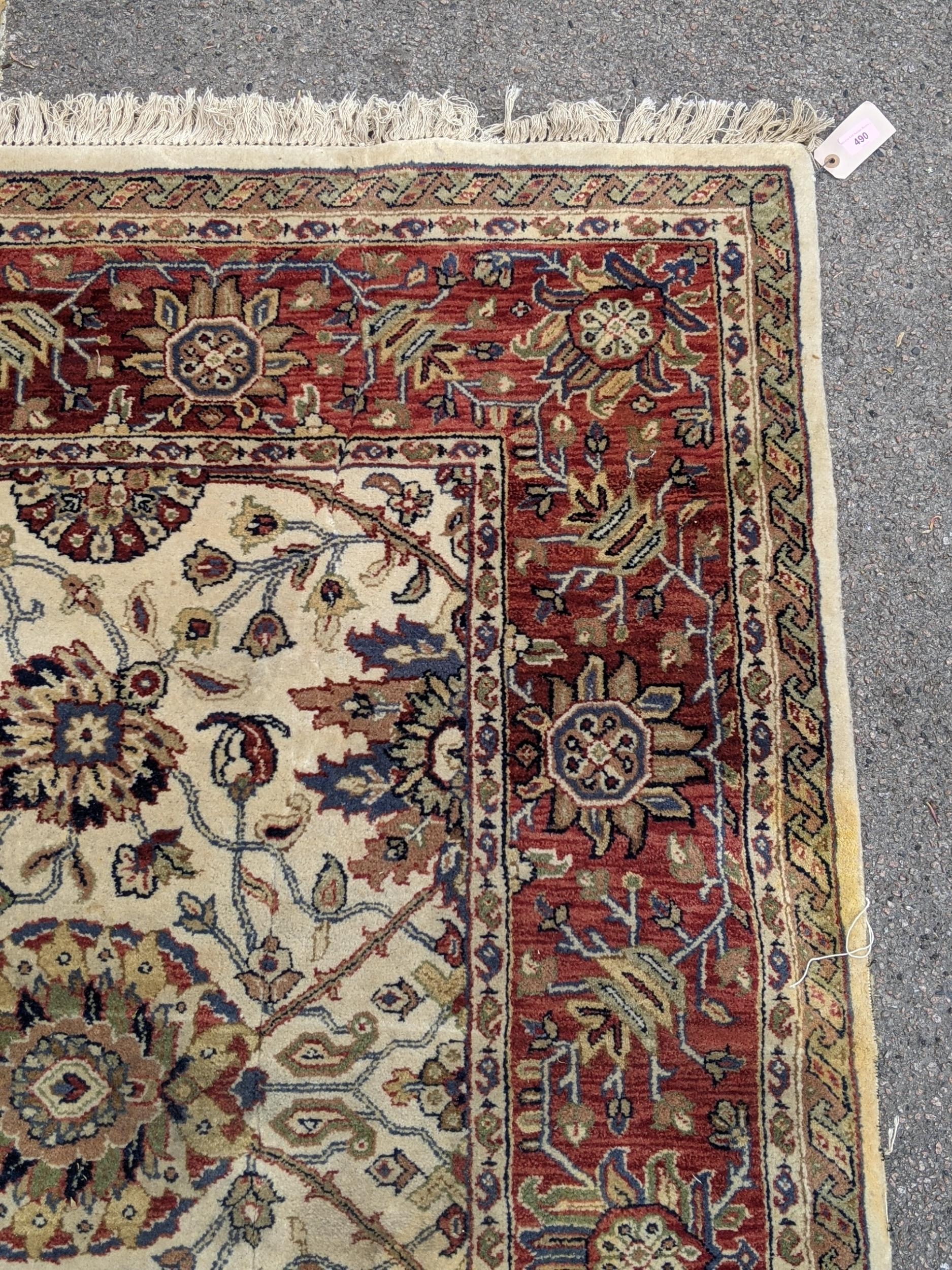 An antique Sharaen rug decorated symmetrically with four large medallions and four smaller ones on a - Image 4 of 9