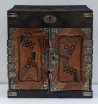 A Japanese early 20th century parquetry inlaid jewellery box having a hinged lid, two doors