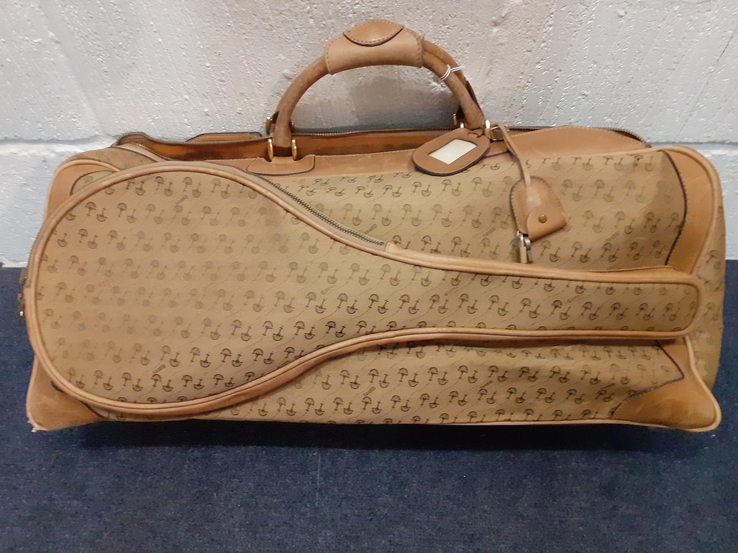 Gucci-A 1960's brown canvas and leather tennis bag A/F in a rare Gucci logo having a luggage