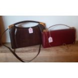 A 1970's brown snakeskin effect handbag with gold tone hardware and detachable shoulder strap