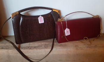 A 1970's brown snakeskin effect handbag with gold tone hardware and detachable shoulder strap