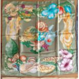 Gucci-A vintage Gucci silk scarf depicting images of a vegetable garden, game and insects on a green