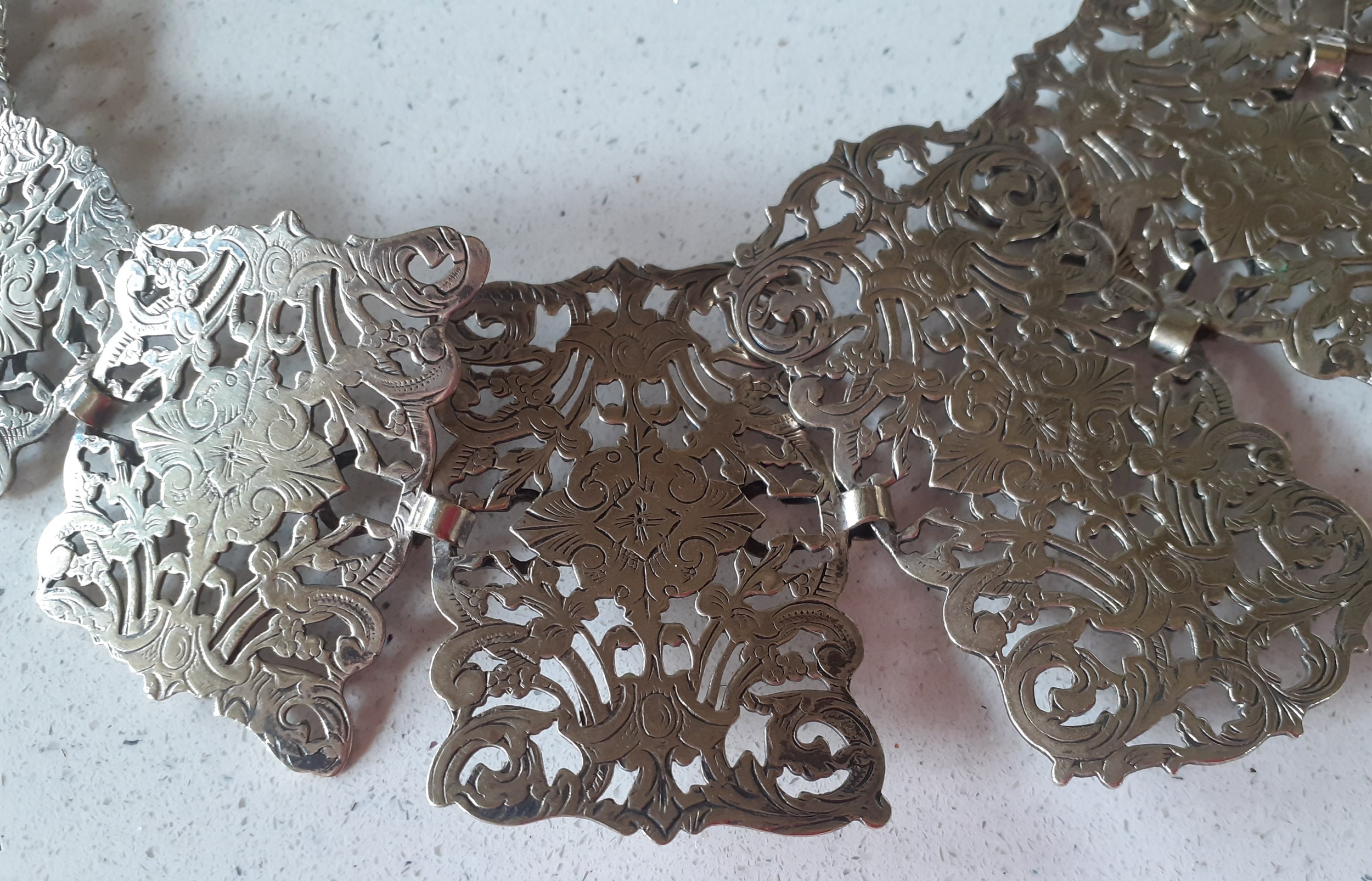 An Edwardian silver plated belt having 16 pierced and engraved floral tablets attached to a black - Image 3 of 4