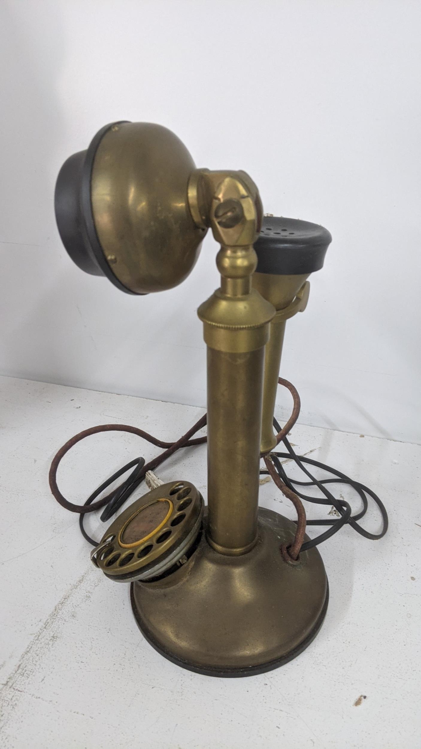 An early to mid 20th century brass candlestick telephone Location: If there is no condition report - Image 2 of 2