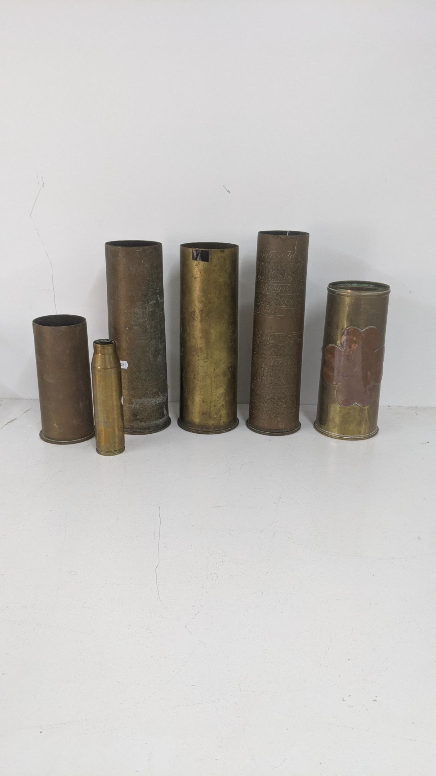 A group of military brass artillery shells, to include an early 20th century possibly Persian