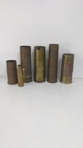 A group of military brass artillery shells, to include an early 20th century possibly Persian
