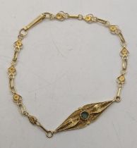 A 18ct gold ladies bracelet set with a blue coloured stone 5.2g Location: If there is no condition