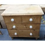 A Victorian small pine chest of two short and two long drawers 84cm h x 85cm w Location: If there is