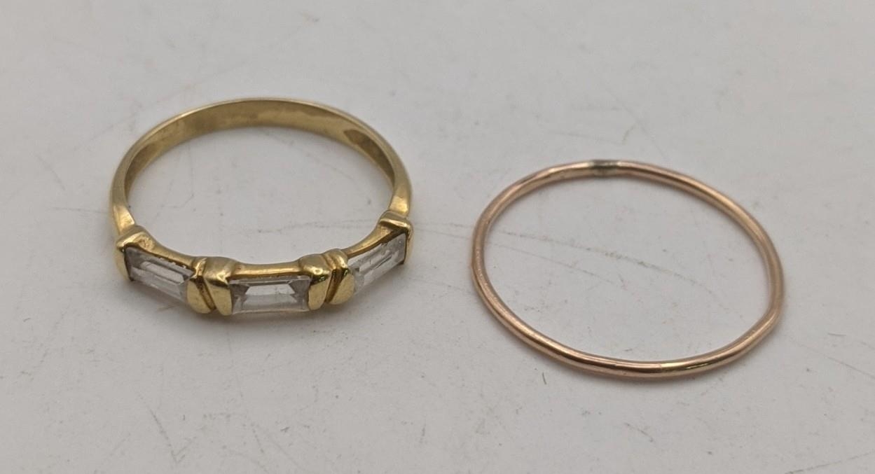 Gold coloured rings, one set with paste stones, tested as 18ct, 2g, and another tested as 9ct, 0.