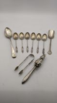 Silver and white meal to include a Peter Rabbit baby rattle A/F, six tea spoons with twisted