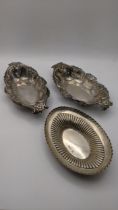 Two white metal embossed floral dishes, together with a silver dish, total weight 205.9g Location: