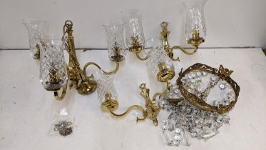 A late 20th century brass chandelier with glass shades and a pair of matching wall lights and a