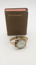 A 14ct gold ladies Victor automatic wristwatch, on a 9ct gold bracelet 34.1g together with a bible