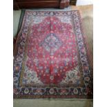An Isfahan rug with a central medallion on a cream coloured ground 205cm x 131cm Location:LAB If